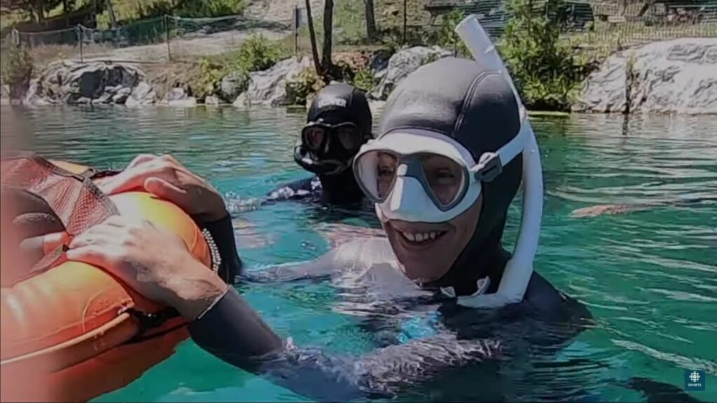Diver in mask going underwater